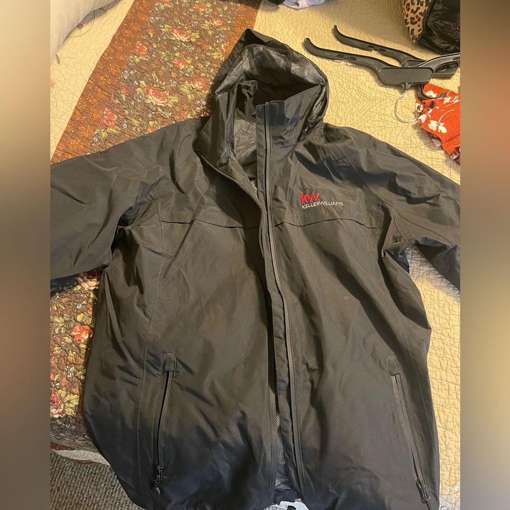 Women’s XL port authority rain coat / wind breaker. Keller Williams logo on it.